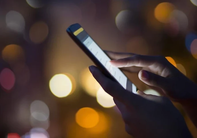 Person using a smartphone while outside