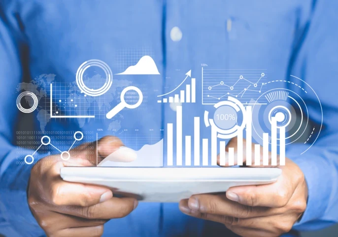 An animated depiction of graphs coming out of a tablet held by a businessman