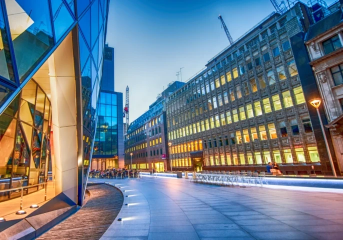 A view of a UK business district at dusk.