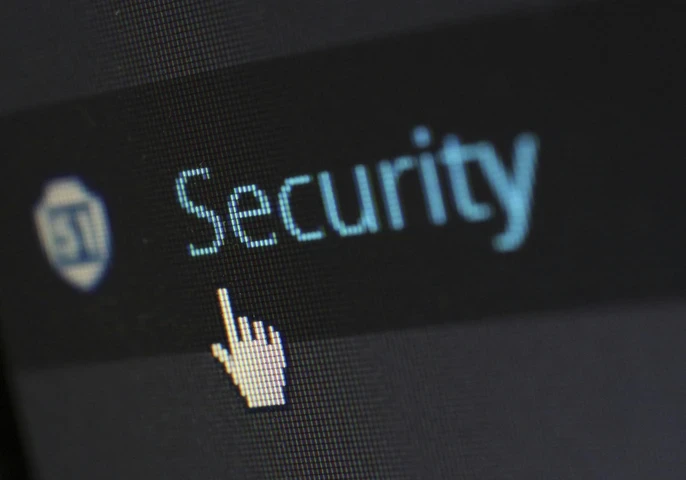cybersecurity on a screen with mouse icon hovering over 