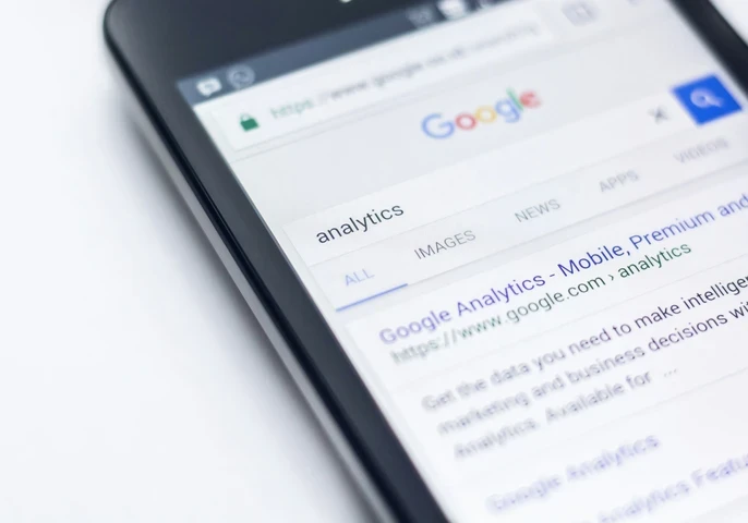 Google search result for "analytics" displayed on a smartphone screen.
