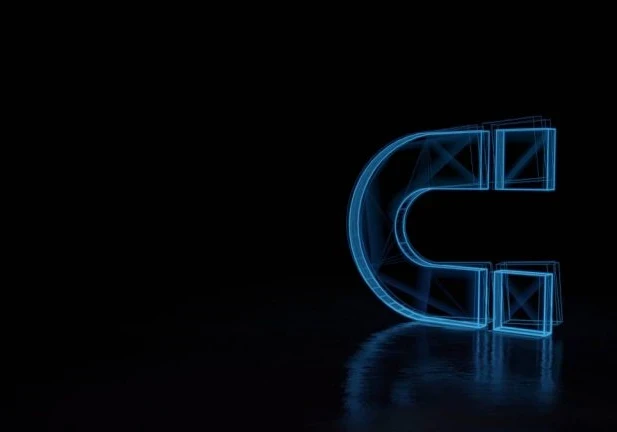 A neon blue illuminated magnet on a black background.