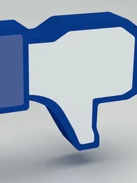 Reaction emoji showing a thumbs down in Meta's Facebook branding