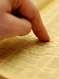 Hand pointing at a directory.