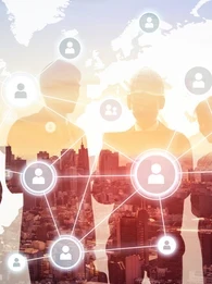 Silhouettes of businesspeople against a city backdrop with icons and profiles overlaid on top.