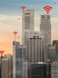 Skyscrapers in a city with WiFi connectivity symbol above each building