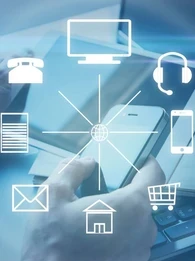 Communication icons overlaid on top of a person using a smartphone, tablet and laptop.
