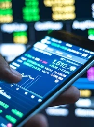 Person using a smartphone to check market prices and stocks
