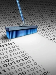 A broom cleaning up binary code.