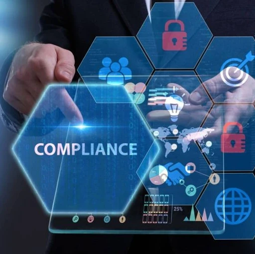 An image with the word "Compliance" and honeycomb shapes with icons in them floating around a person holding a tablet.