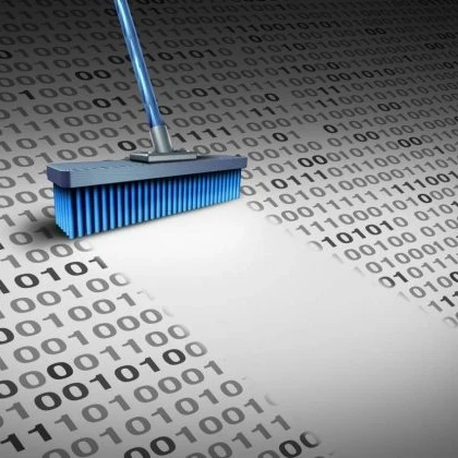 A broom cleaning up binary code.
